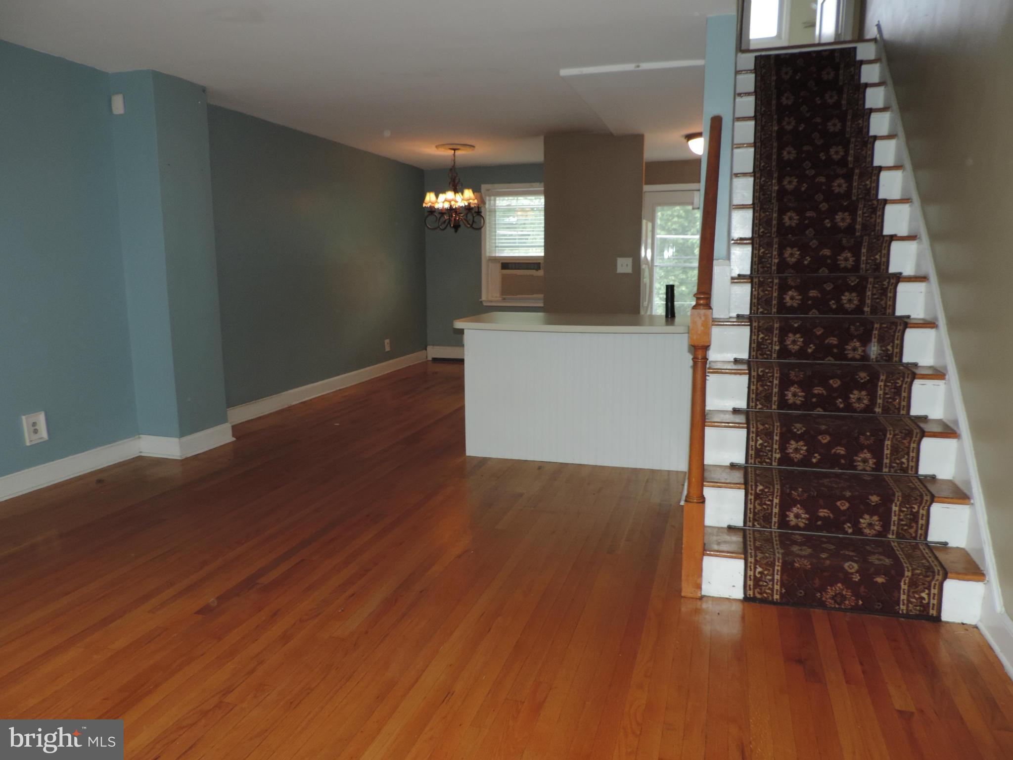 1124 Elm Road Baltimore, MD 21227 - Photo 2 of 13 wooden floor in an empty room