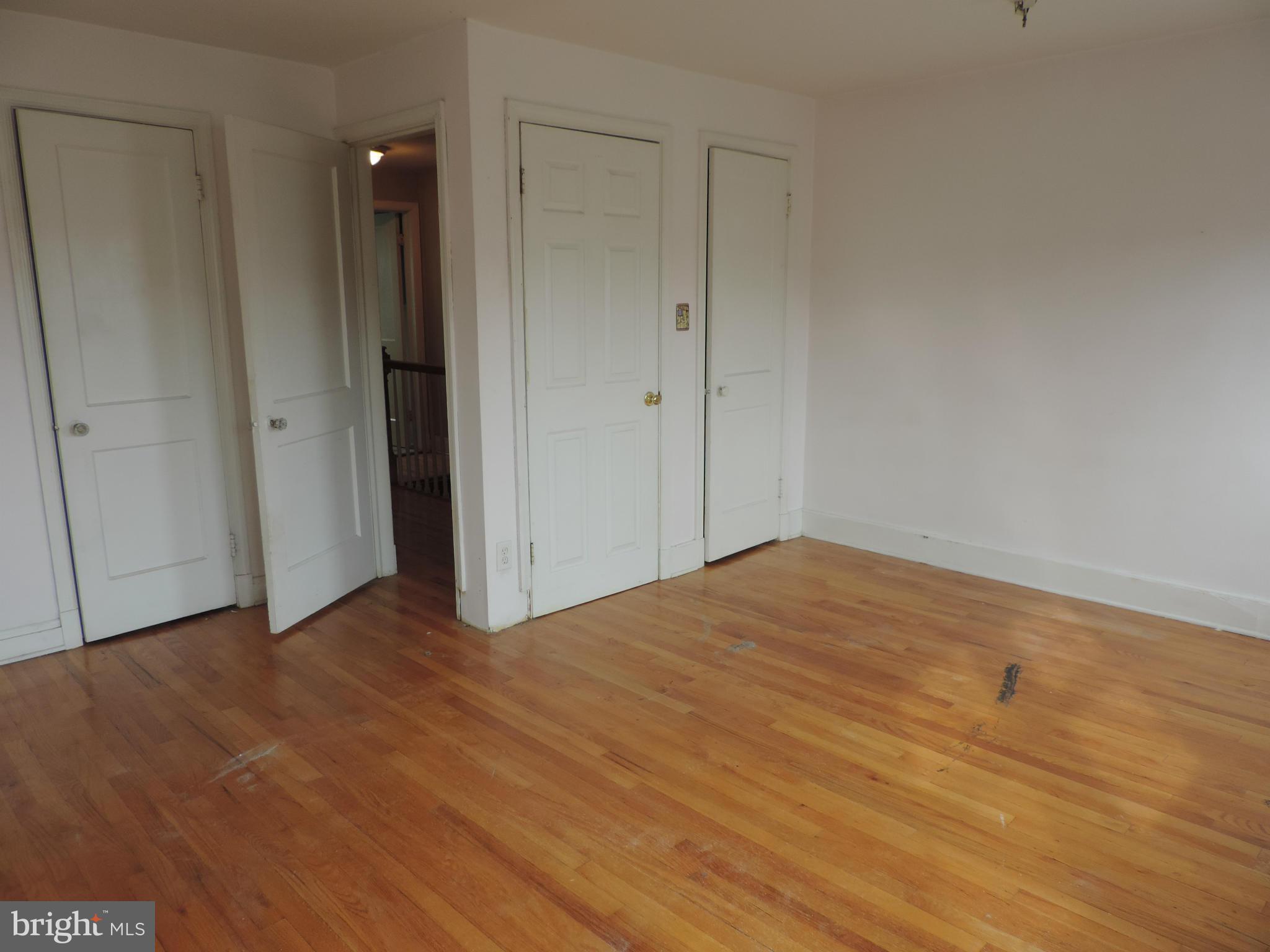 1124 Elm Road Baltimore, MD 21227 - Photo 12 of 13 a view of empty room with wooden floor