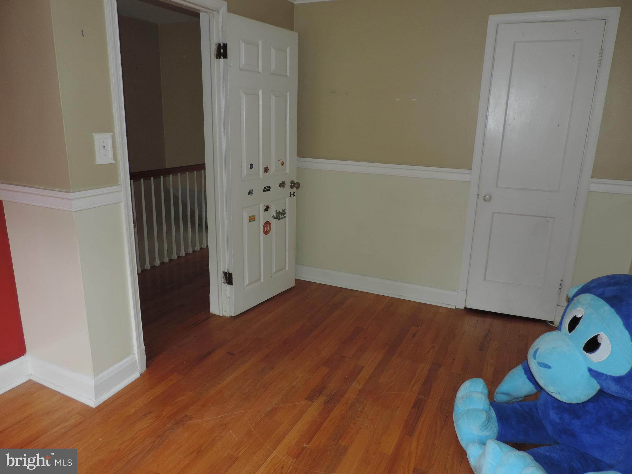 1124 Elm Road Baltimore, MD 21227 - Photo 10 of 13 a view of entryway with wooden floor