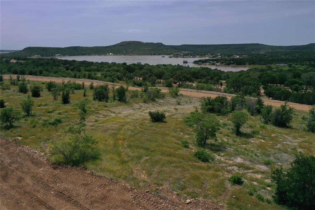 Lot 126 White Moon Road Graham, TX 76450 - Photo 1 of 40 a view of lake with mountain