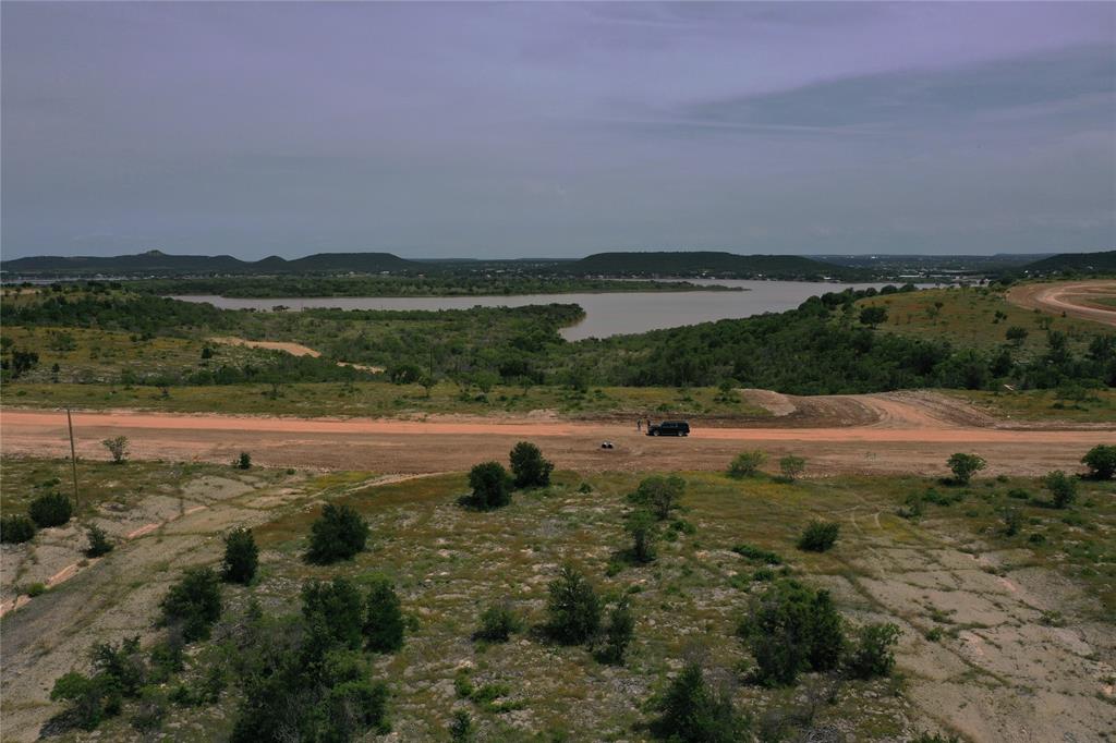 Lot 126 White Moon Road Graham, TX 76450 - Photo 13 of 40 a view of a lake with houses in the background