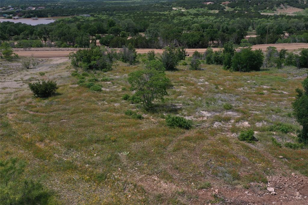 Lot 126 White Moon Road Graham, TX 76450 - Photo 18 of 40 a view of a dry yard with green space