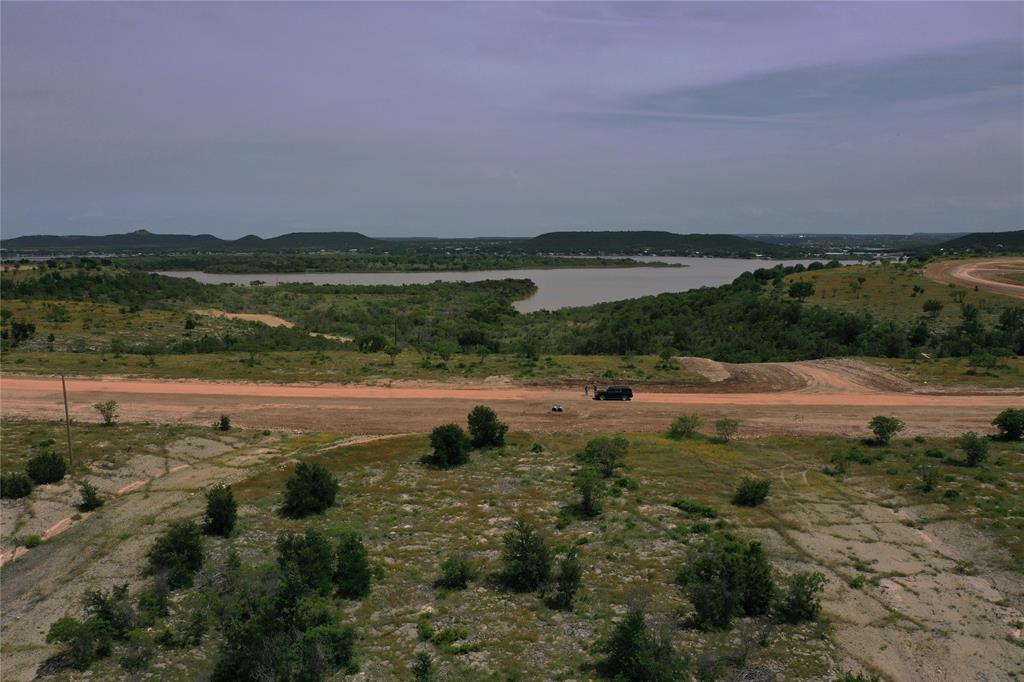Lot 126 White Moon Road Graham, TX 76450 - Photo 20 of 40 a view of a lake with houses in the background