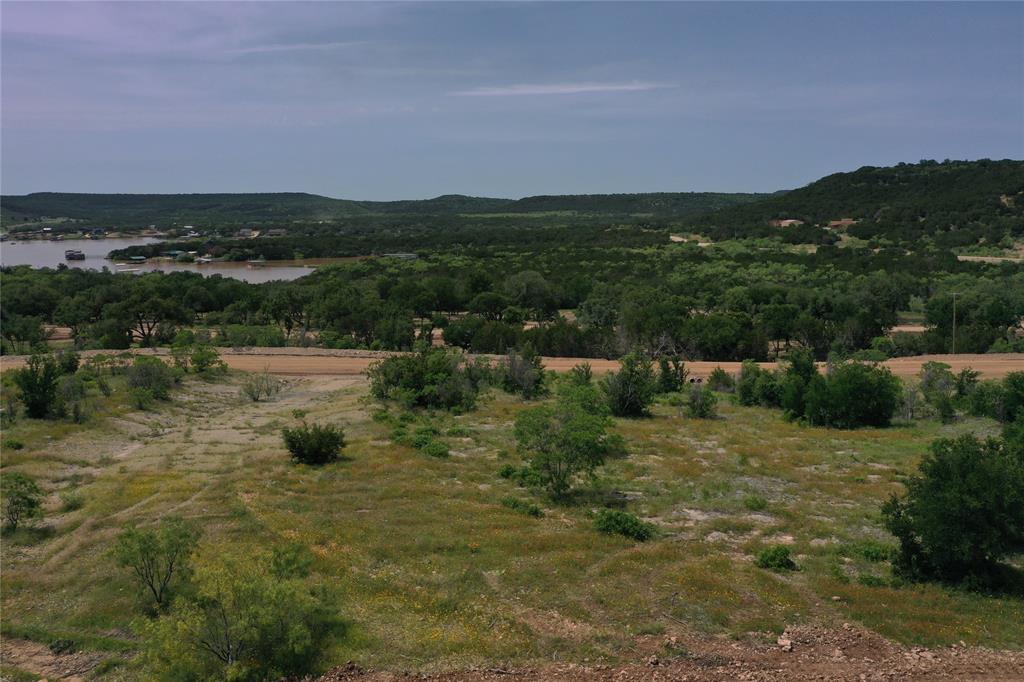 Lot 126 White Moon Road Graham, TX 76450 - Photo 27 of 40 a view of a lake with a mountain