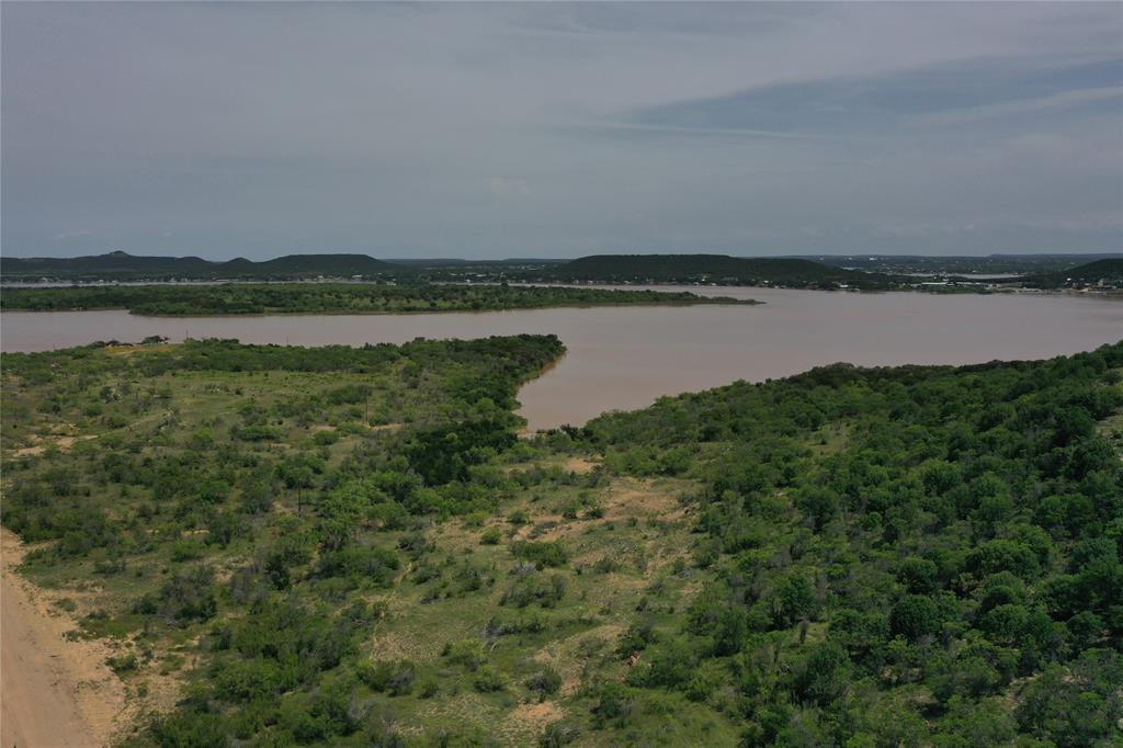 Lot 126 White Moon Road Graham, TX 76450 - Photo 36 of 40 a view of a lake with houses in the back
