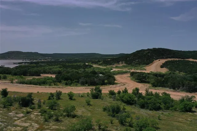 an aerial view of residential house with outdoor space and river