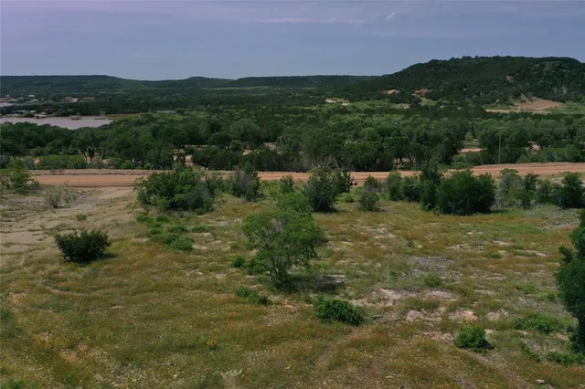 a view of a green field with clear sky