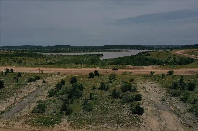 a view of a lake with a yard