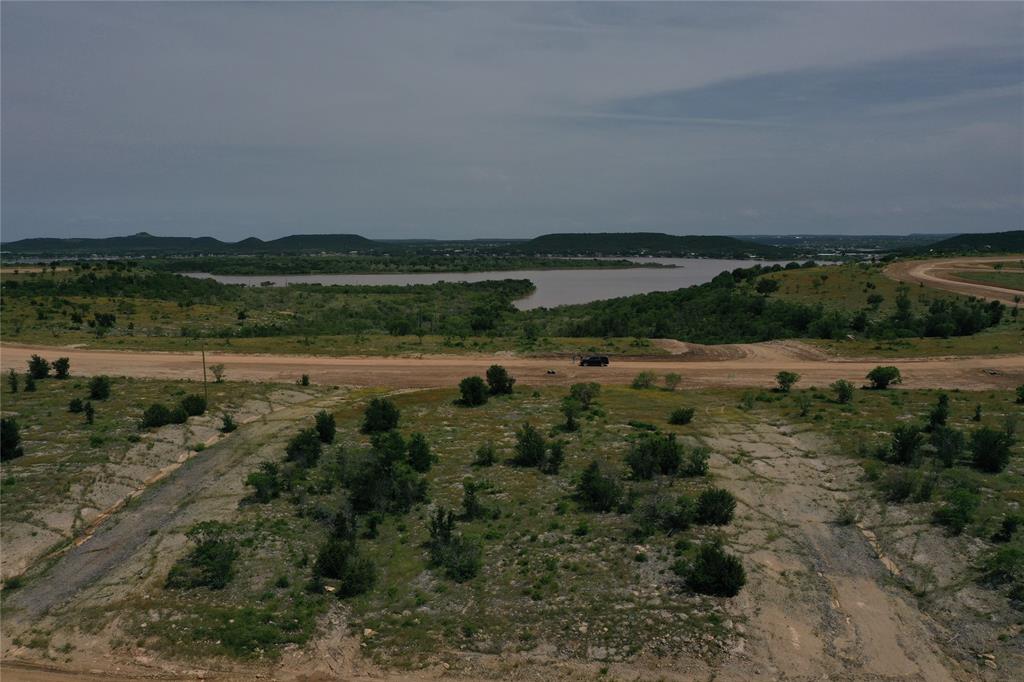 Lot 126 White Moon Road Graham, TX 76450 - Photo 8 of 40 a view of a lake with a yard