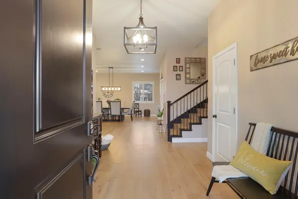 a large kitchen with stainless steel appliances kitchen island granite countertop a large island in the center