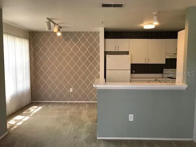 a view of walk in closet with window