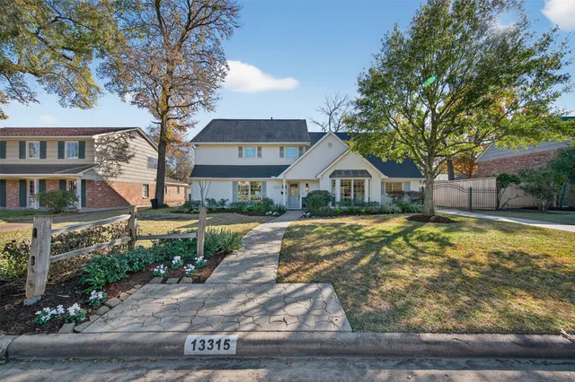 a house with trees in the background
