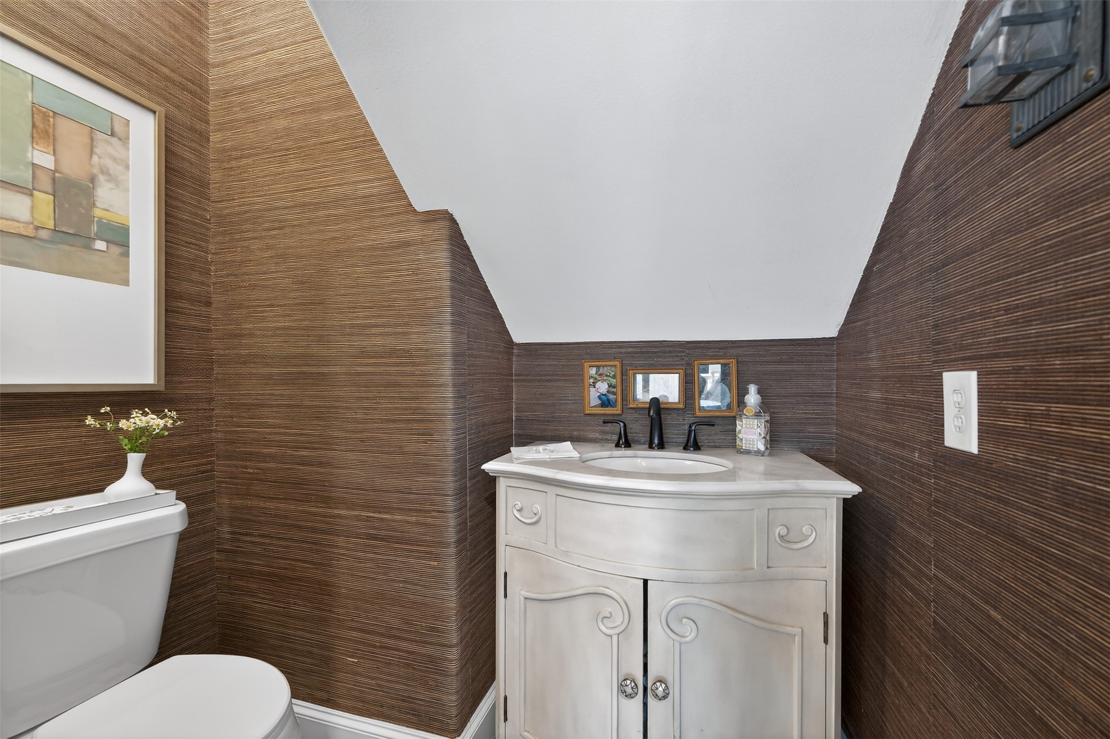 13315 Tosca Lane Houston, TX 77079 - Photo 14 of 42 a bathroom with a toilet sink vanity and mirror