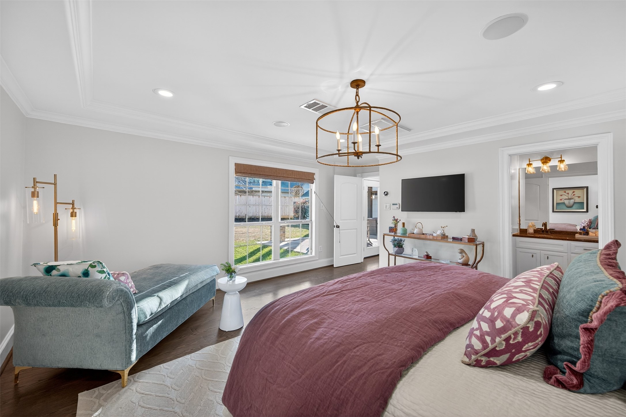 13315 Tosca Lane Houston, TX 77079 - Photo 22 of 42 a spacious bedroom with a bed and a flat screen tv