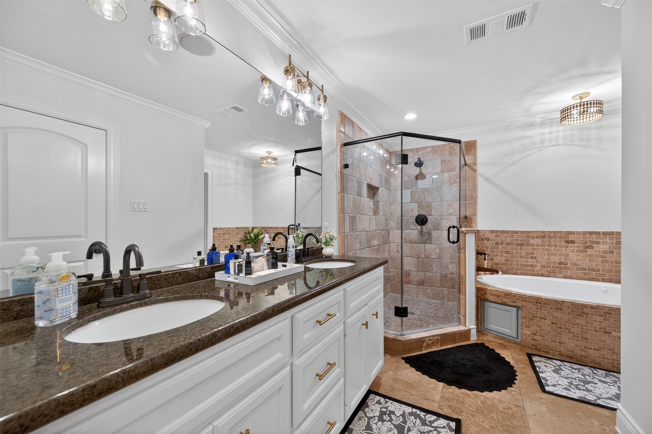 13315 Tosca Lane Houston, TX 77079 - Photo 23 of 42 a bathroom with a double vanity sink a toilet a mirror and shower