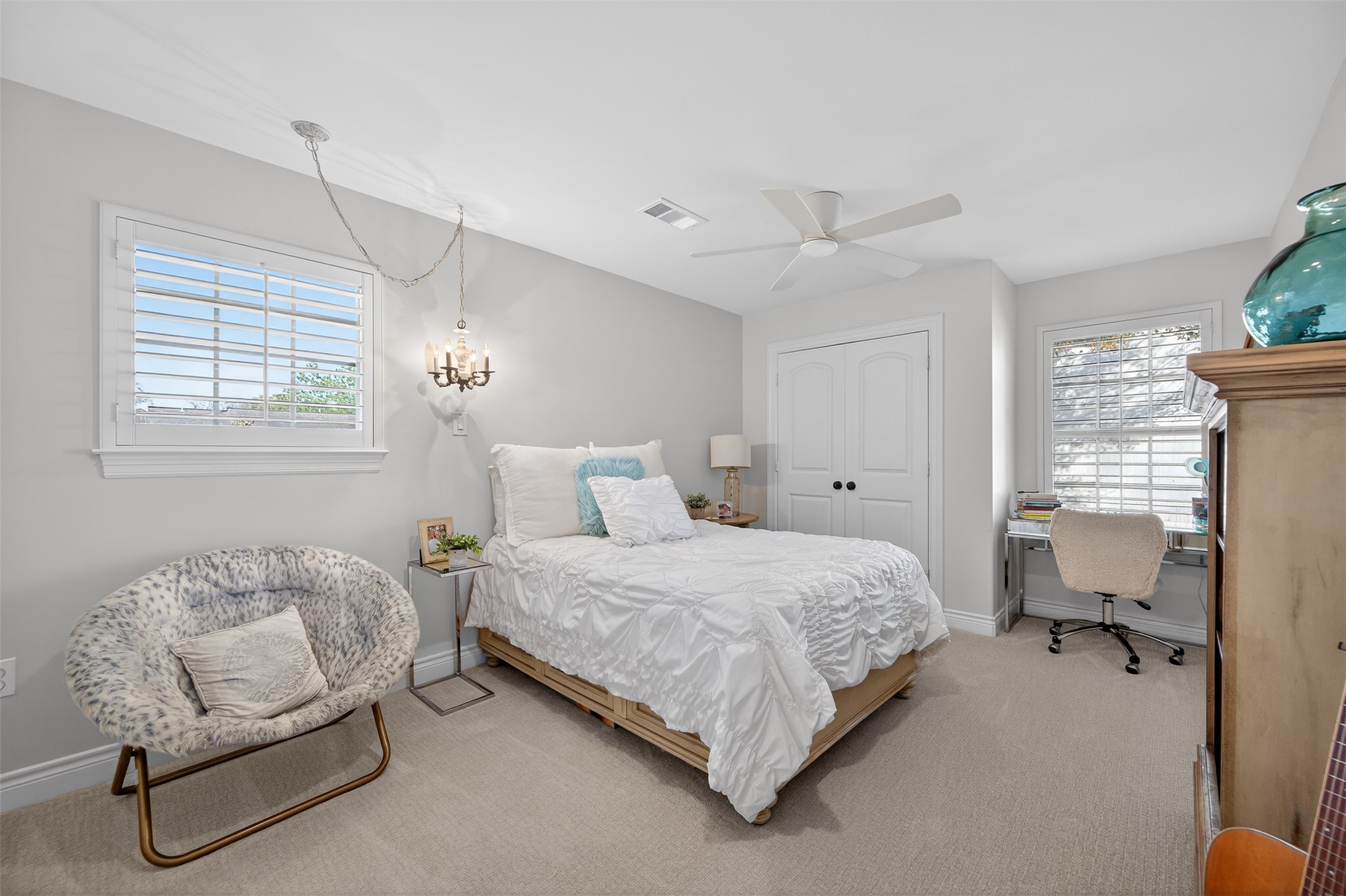 13315 Tosca Lane Houston, TX 77079 - Photo 26 of 42 a bedroom with a bed chair and a window