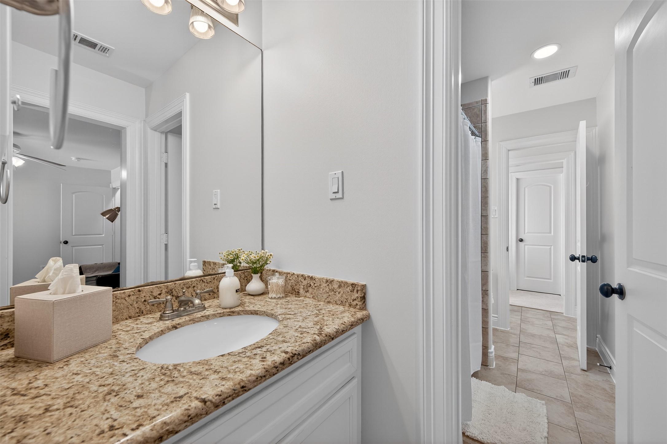 13315 Tosca Lane Houston, TX 77079 - Photo 29 of 42 a bathroom with a granite countertop sink and a mirror
