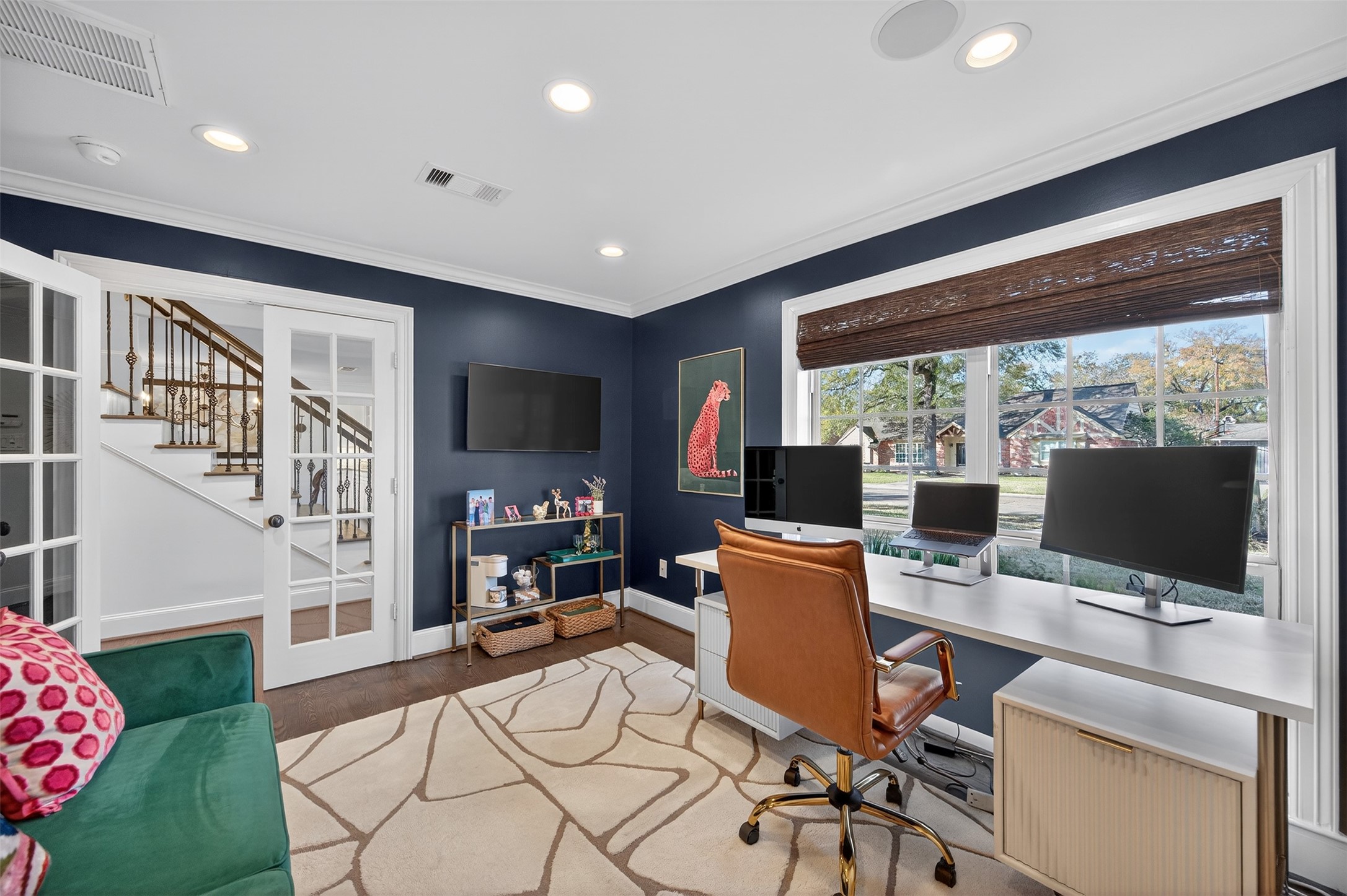 13315 Tosca Lane Houston, TX 77079 - Photo 5 of 42 a work room with furniture a flat screen tv and a floor to ceiling window