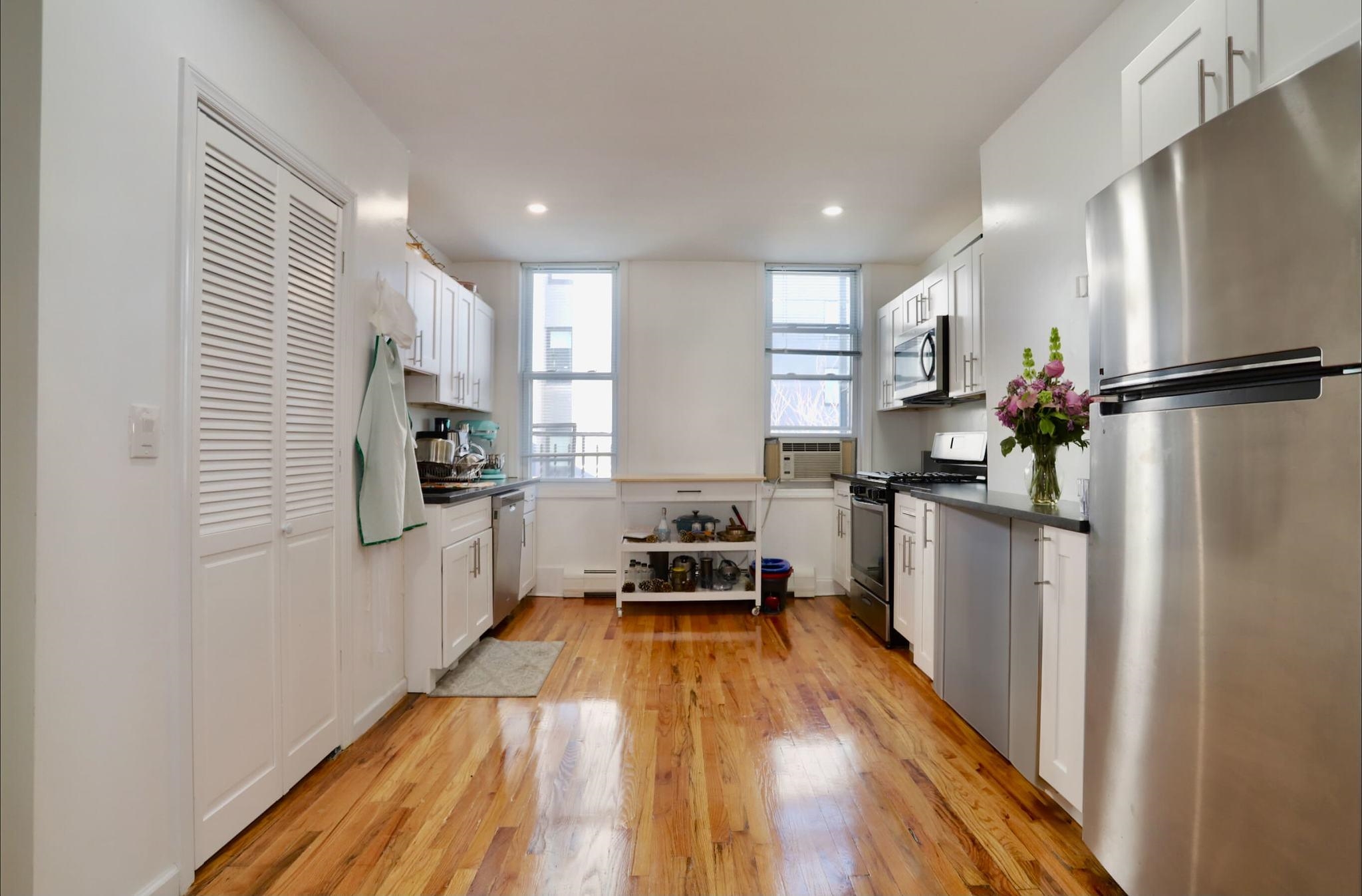 402 Monroe Street, Unit 2 Hoboken, NJ 07030 - Photo 1 of 22 a kitchen with a refrigerator and a sink