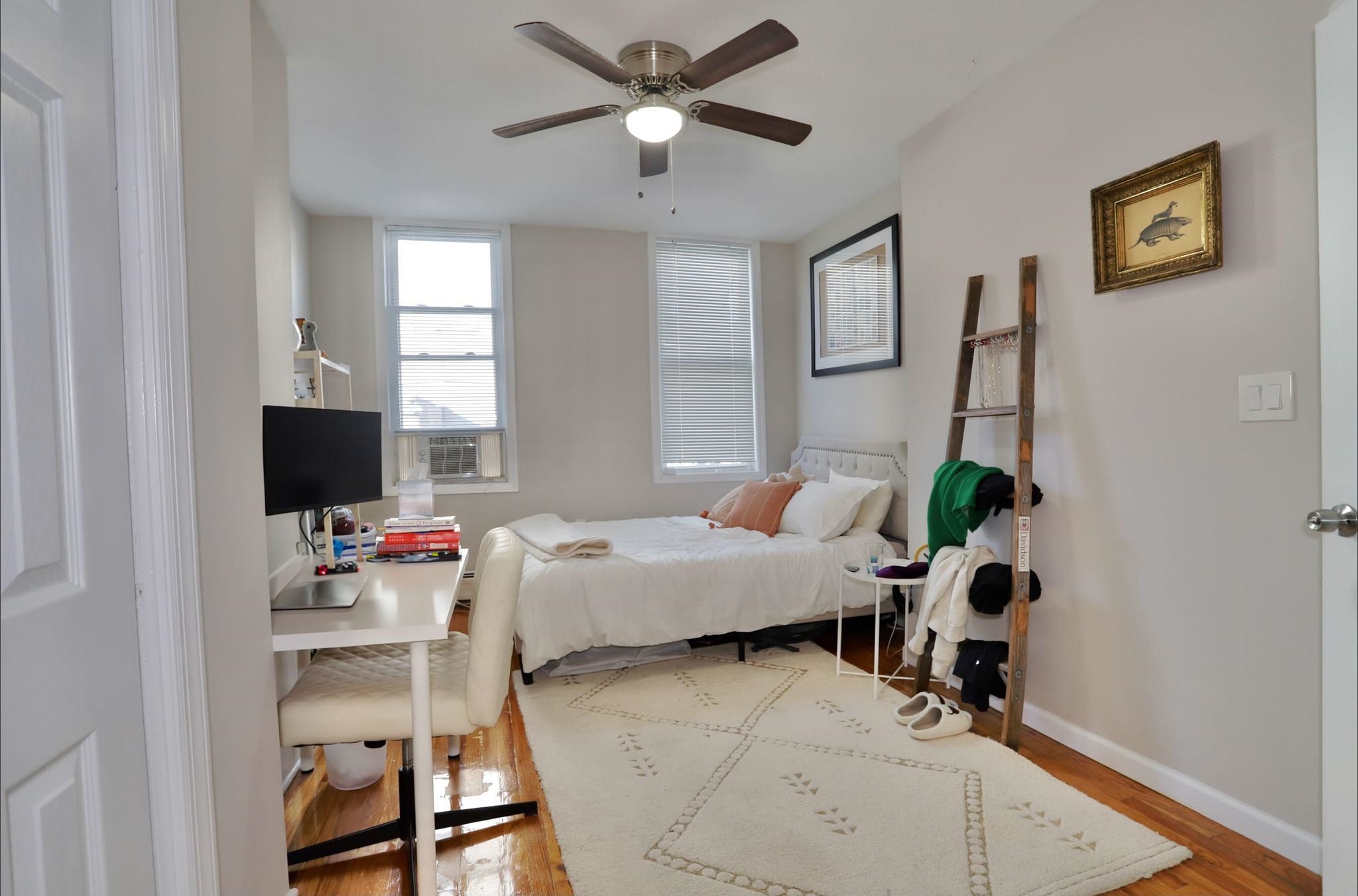402 Monroe Street, Unit 2 Hoboken, NJ 07030 - Photo 13 of 22 a living room with furniture and a flat screen tv