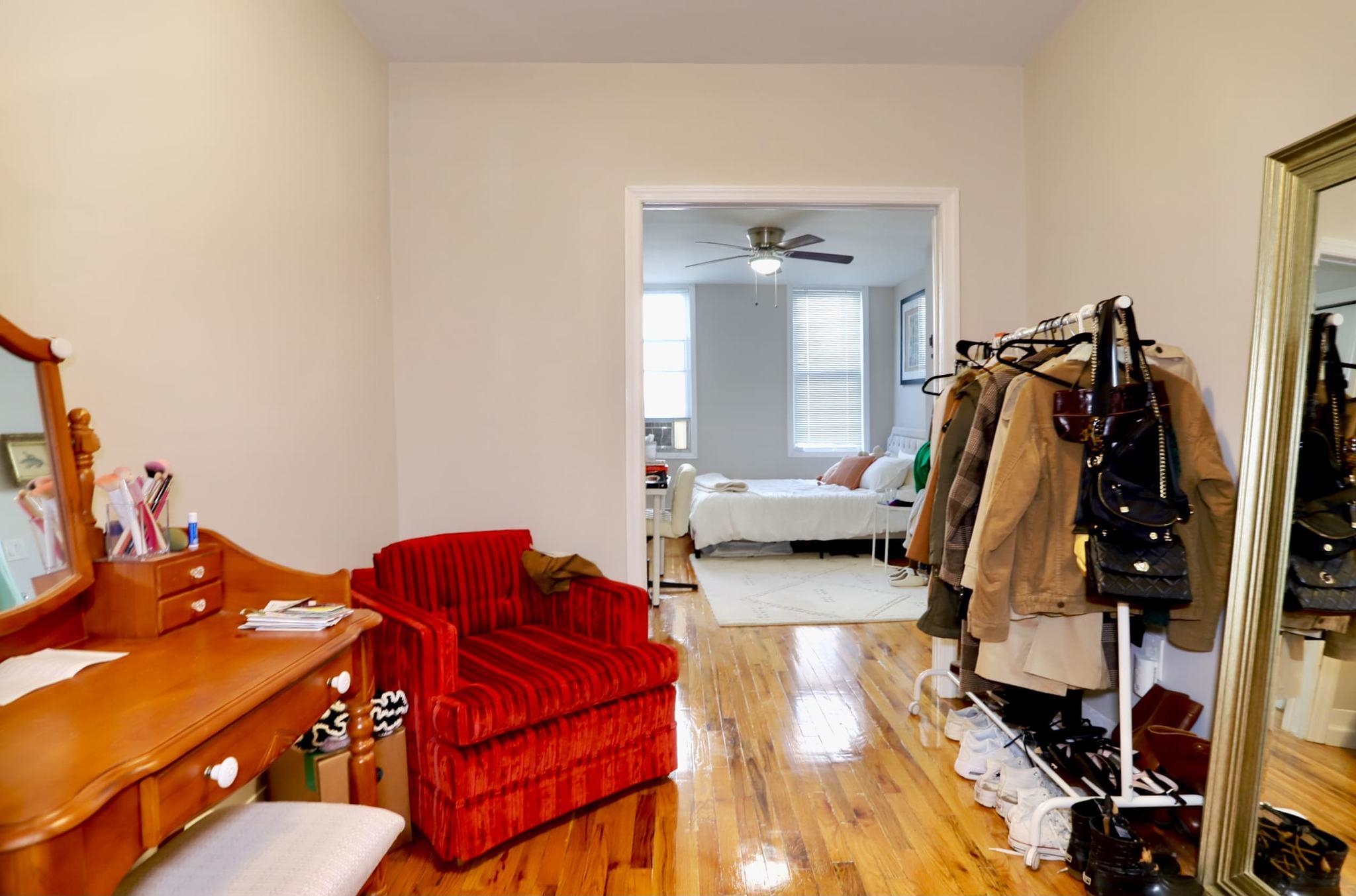 402 Monroe Street, Unit 2 Hoboken, NJ 07030 - Photo 16 of 22 a living room with furniture and a lamp