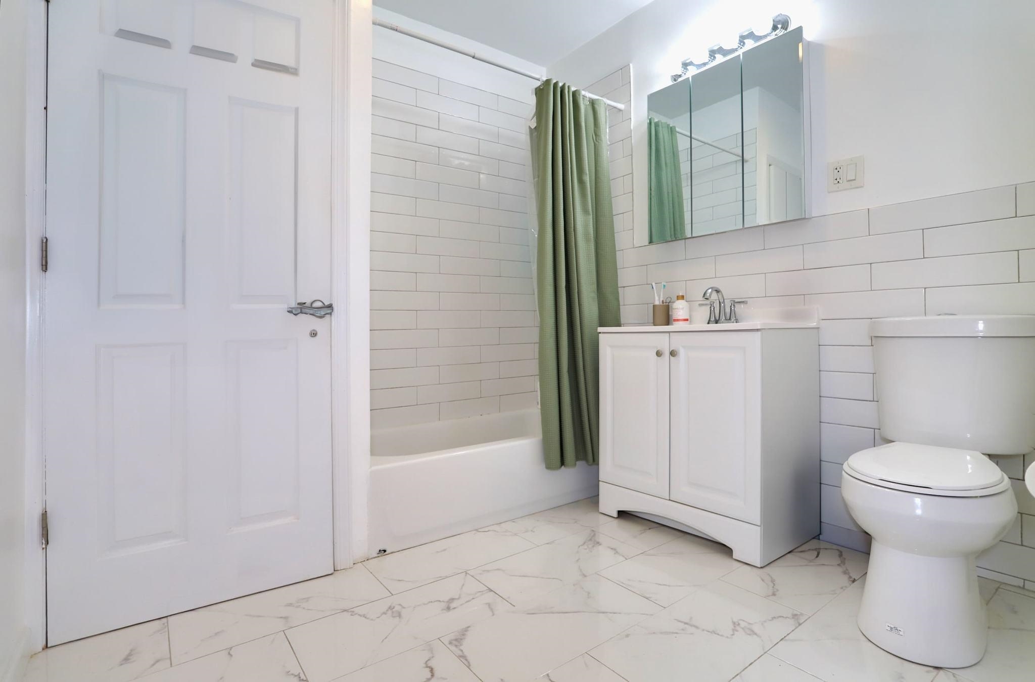 402 Monroe Street, Unit 2 Hoboken, NJ 07030 - Photo 19 of 22 a bathroom with a sink and a toilet
