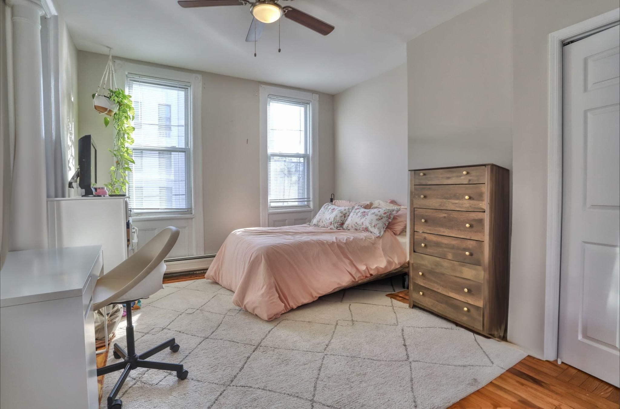 402 Monroe Street, Unit 2 Hoboken, NJ 07030 - Photo 20 of 22 a bedroom with a bed a chair and next to a window
