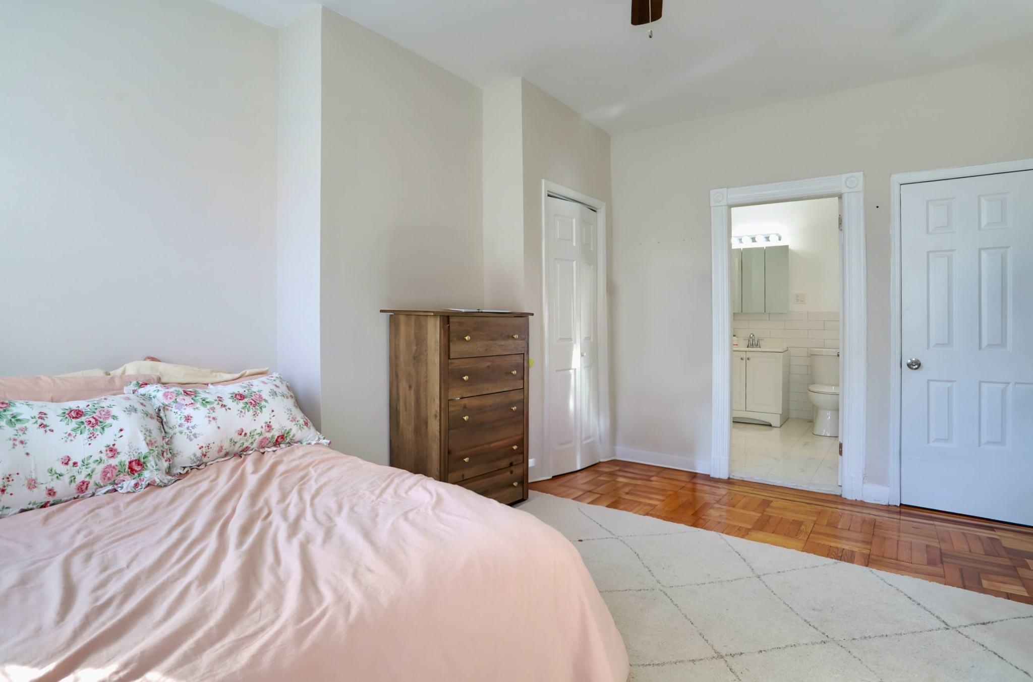 402 Monroe Street, Unit 2 Hoboken, NJ 07030 - Photo 21 of 22 a bedroom with a bed and a painting on the wall