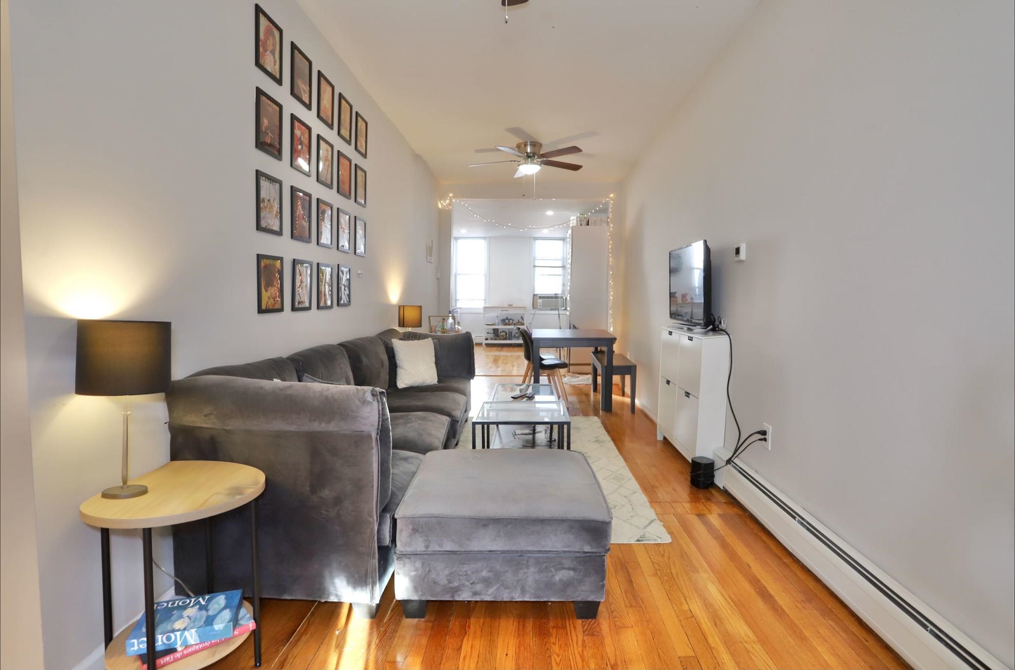 402 Monroe Street, Unit 2 Hoboken, NJ 07030 - Photo 7 of 22 a living room with furniture and a lamp