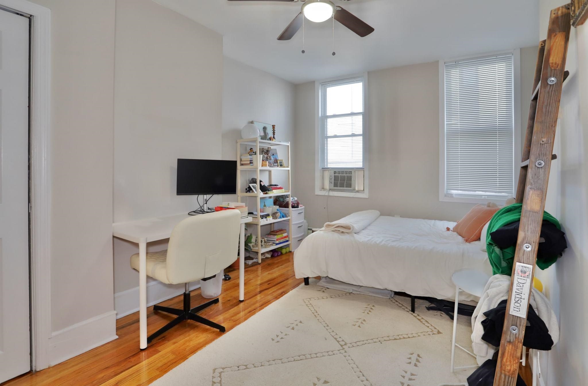 402 Monroe Street, Unit 2 Hoboken, NJ 07030 - Photo 9 of 22 a bedroom with a bed window and a flat screen tv