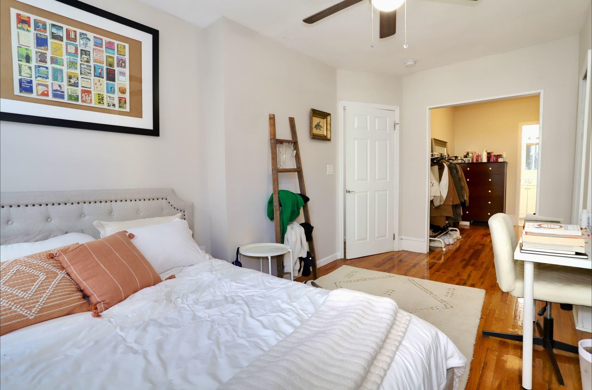 402 Monroe Street, Unit 2 Hoboken, NJ 07030 - Photo 10 of 22 a bedroom with a bed and a painting on the wall