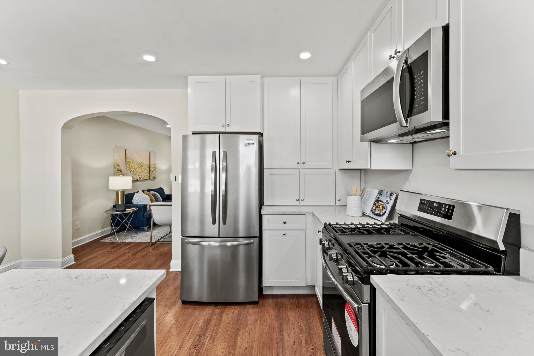 1764 Lyman Place Northeast Washington, DC 20002 - Photo 15 of 35 a kitchen with stainless steel appliances granite countertop a refrigerator stove top oven and sink