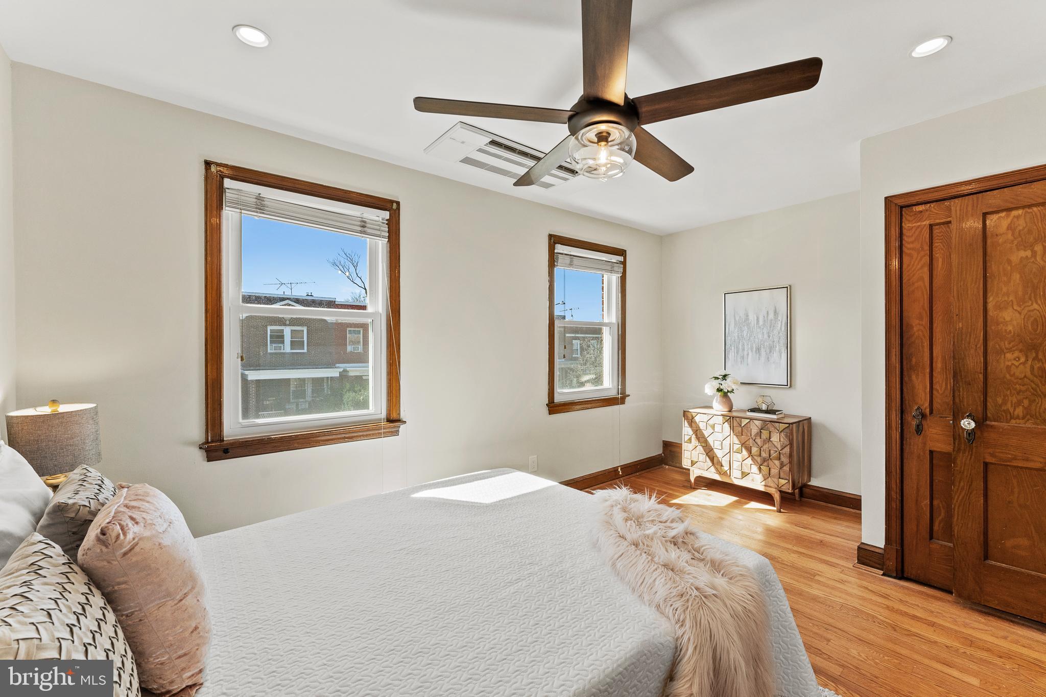 1764 Lyman Place Northeast Washington, DC 20002 - Photo 18 of 35 a bedroom with a bed and wooden floor