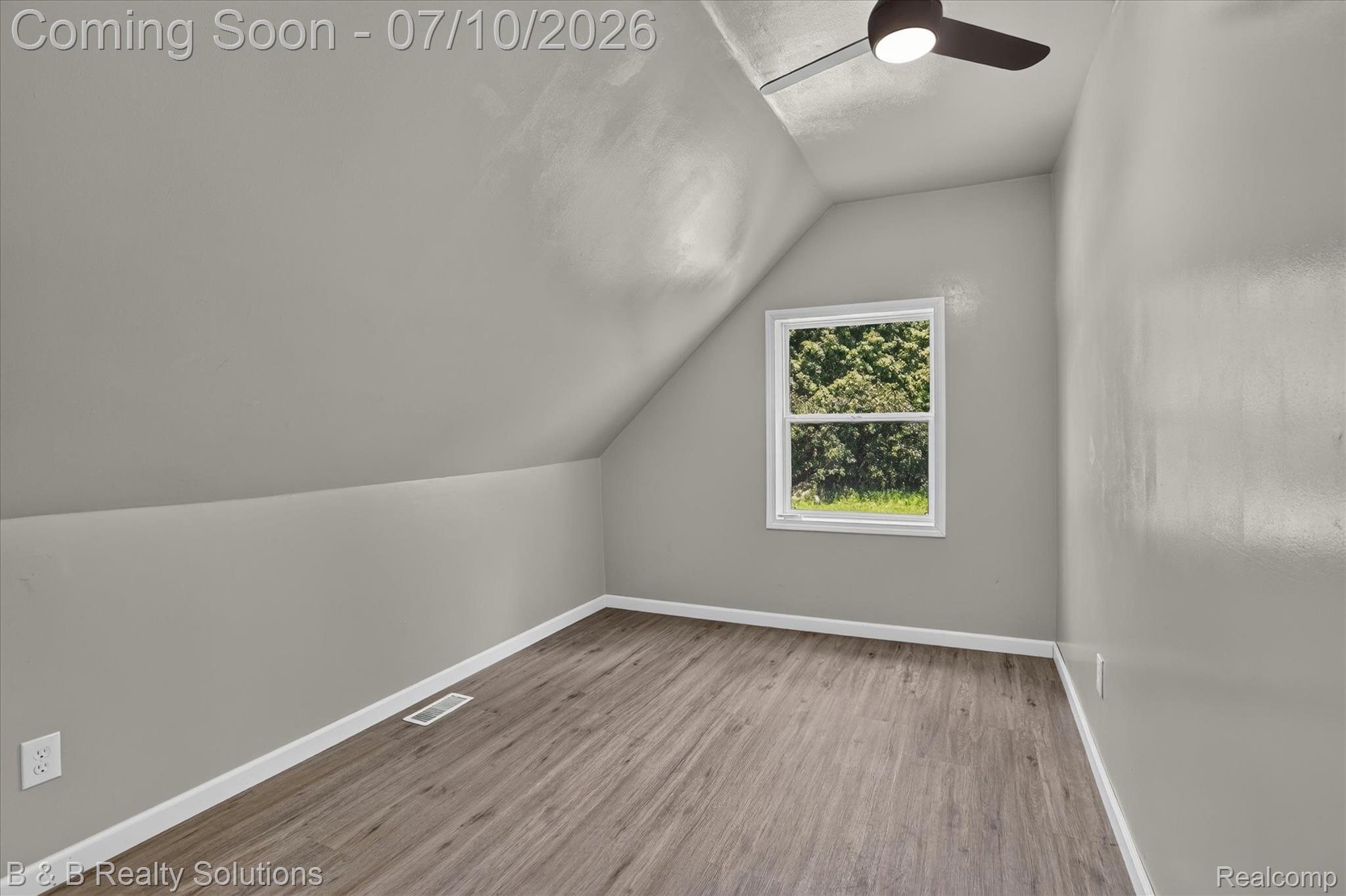 1564 East Burnside Road North Branch, MI 48461 - Photo 20 of 25 Room featuring sloped ceilings, wood-finish flooring, a white-framed window, and a ceiling fan with integrated lighting