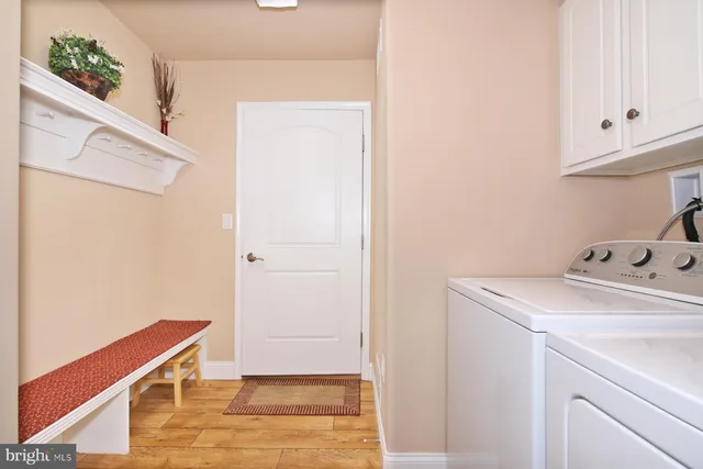a living room with furniture and next to a window