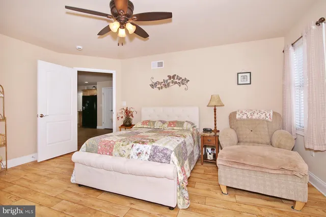 a bathroom with a sink toilet and mirror