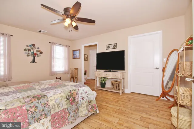 a bathroom with a double vanity sink a mirror and a shower
