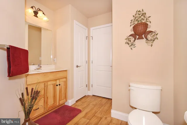 a front view of a house with a large window and a yard