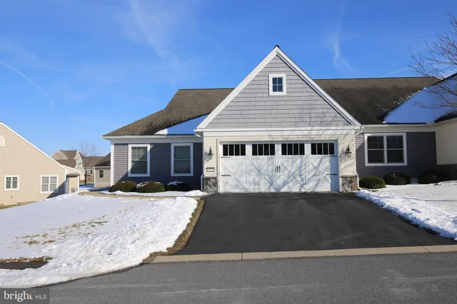 a kitchen with stainless steel appliances granite countertop a stove a sink and a white cabinets