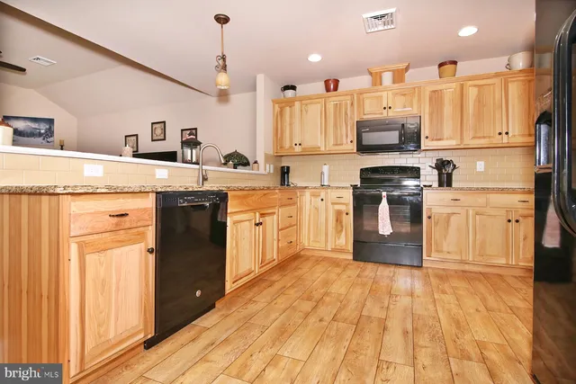 a view of a kitchen from the hallway