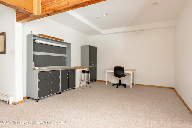 a room with chair and a window