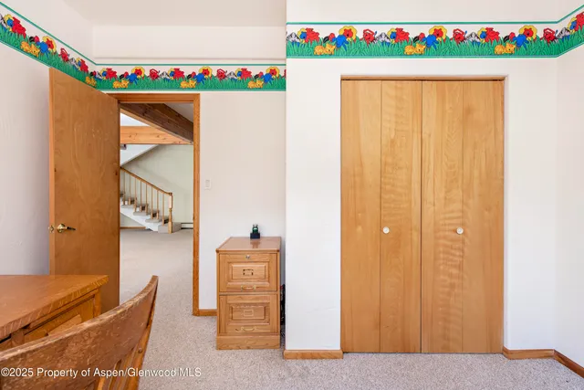 a bedroom with a bed and a table