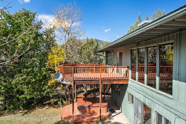 a view of balcony with wooden floor and outdoor seating
