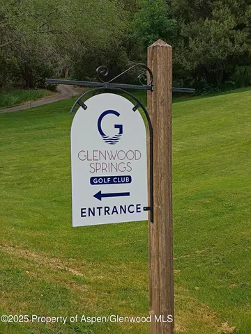 a sign on the side of the park