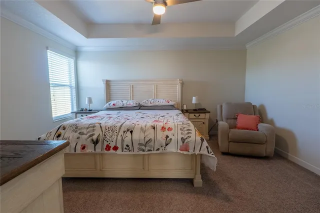 a spacious bathroom with a granite countertop sink a mirror and a bathtub