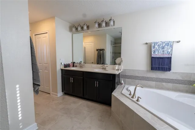 a view of a hallway with wooden shelves