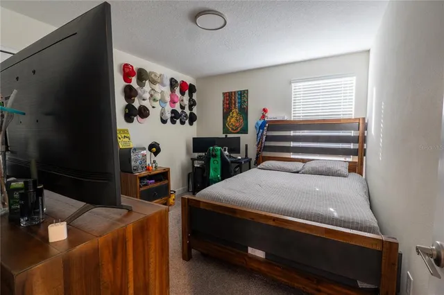 a bedroom with a bed and cabinets