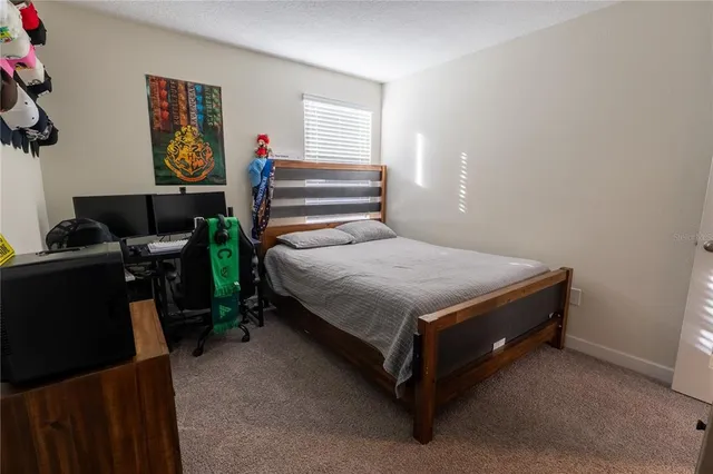 a bathroom with a double vanity sink a mirror and a shower