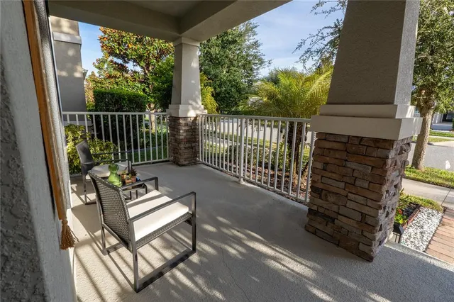 a view of a two chairs in the balcony