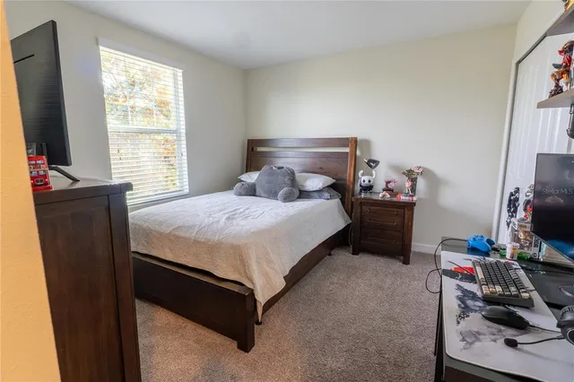 a bedroom with a bed and furniture